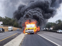 An RV on fire on the freeway