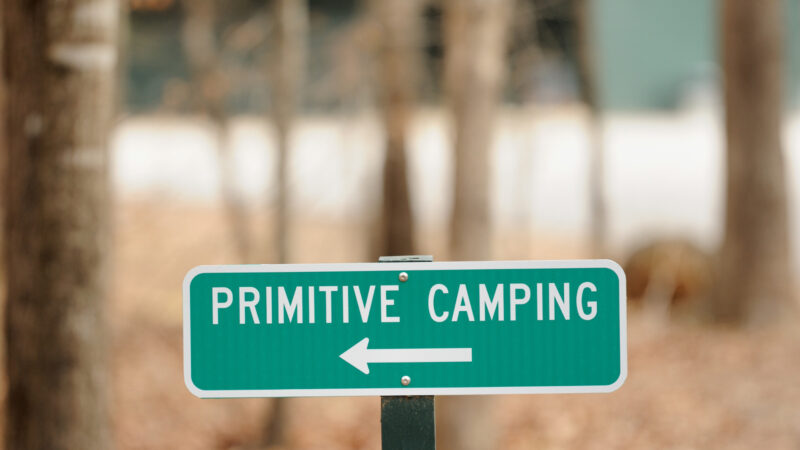 A sign leading to a primitive camping location