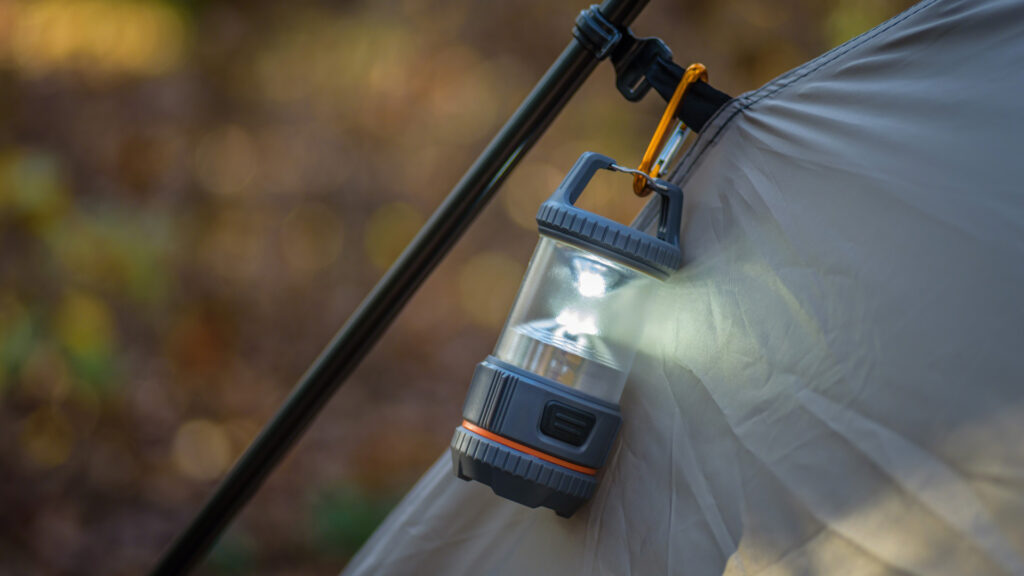 A rechargeable lantern attached to a tent
