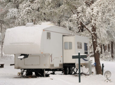 An RV without RV skirting at a campground in the winter