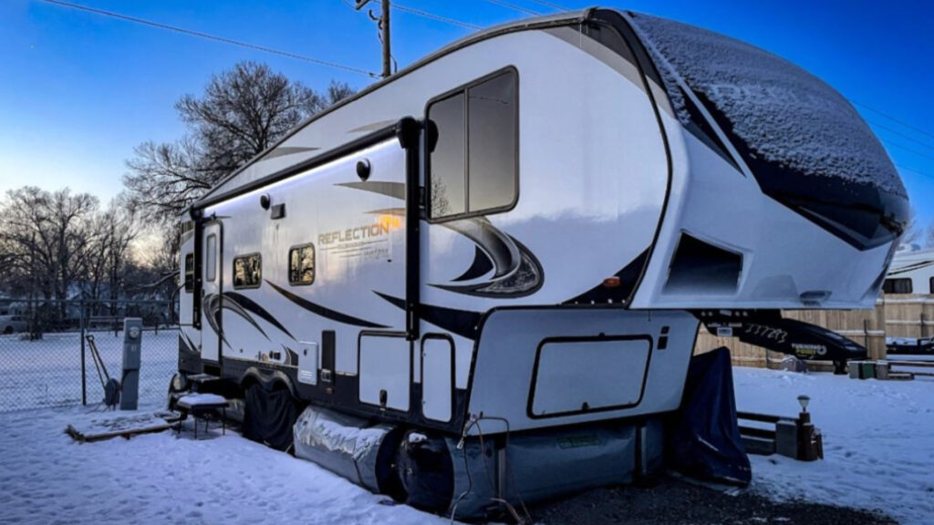 RV skirting on a rig at a campground in the winter