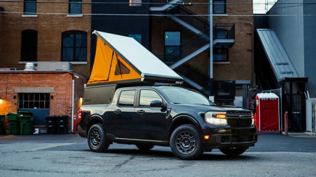A ford maverick camper parked outside