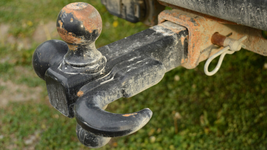 Close-up of a trailer hitch stuck to the ball
