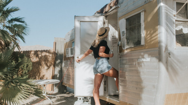 A woman walking into her RV after replacing her RV lock on her door
