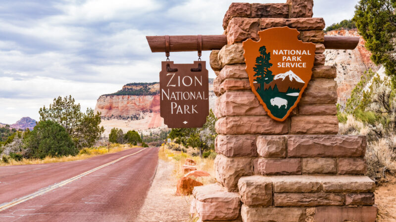 View of a zion national park sign as you enter the park