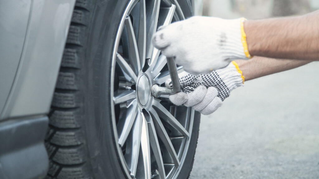 Close up of a person inspecting their tire