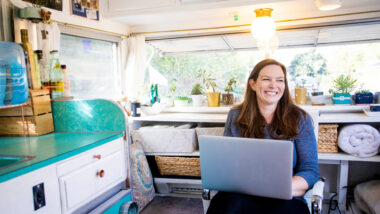 A woman buying Battle Born Batteries stock in her RV