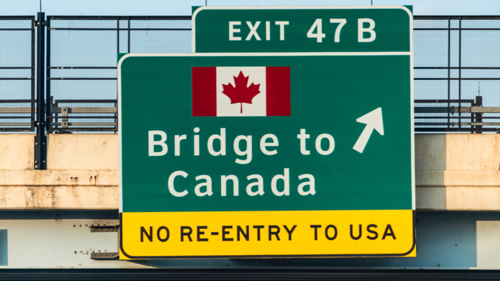 View of a sign to a bridge to Canada