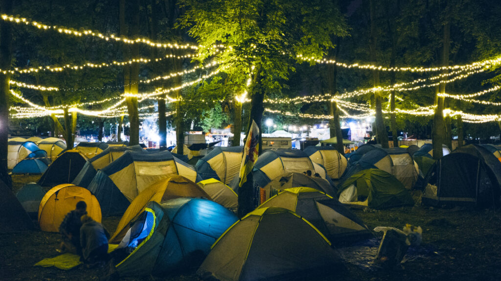 A busy campground at a music festival 