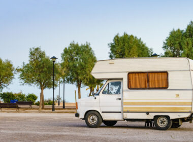 A wooden frame RV parked outside