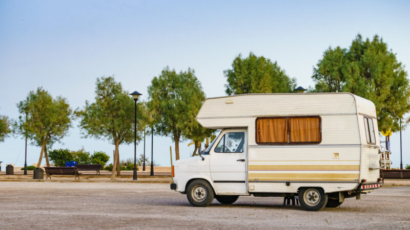 A wooden frame RV parked outside