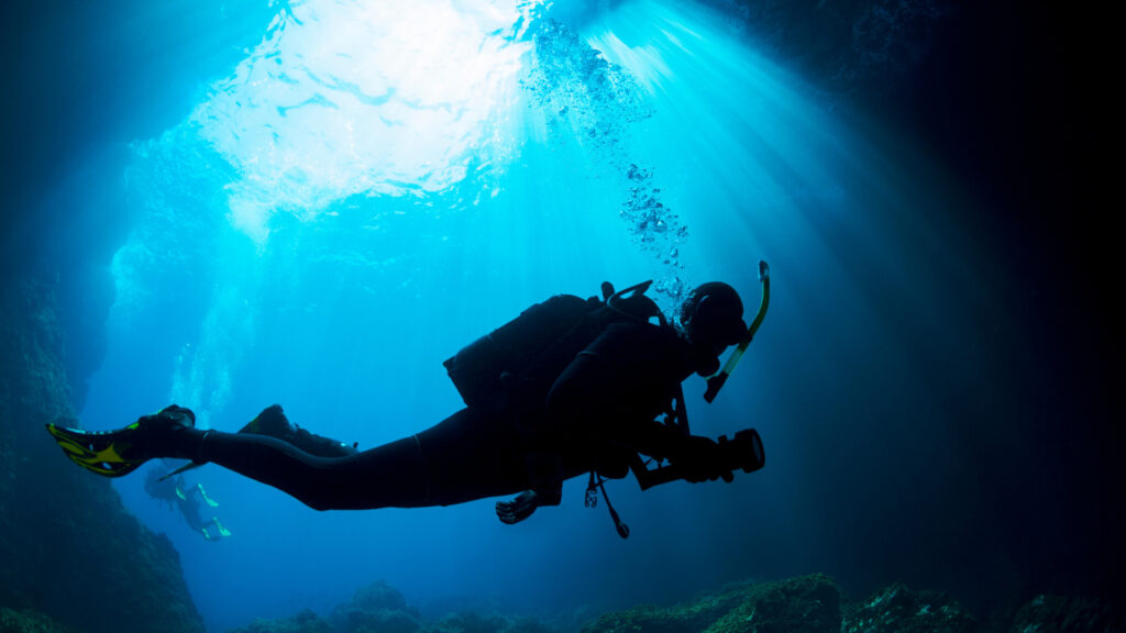A person cave diving at Morrison springs