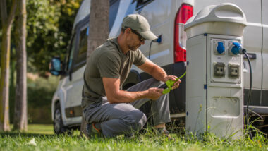 A man putting a lock on his rv surge protector