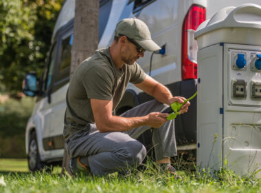A man putting a lock on his rv surge protector