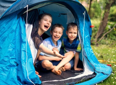 Kids playing in their camping tent