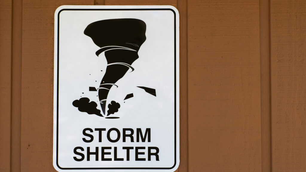 A sign at a storm shelter for tornadoes