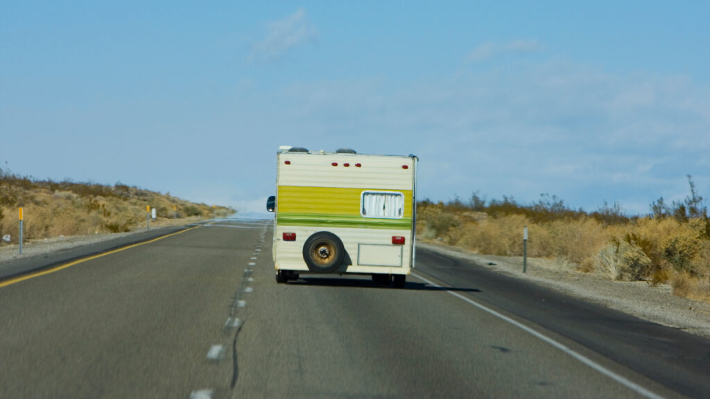An older RV on the road