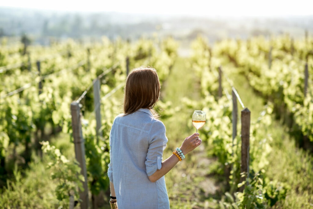 Woman with a glass of wine in Colorado vineyards