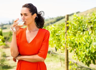 Woman drinking glass of wine in Colorado winery vineyards