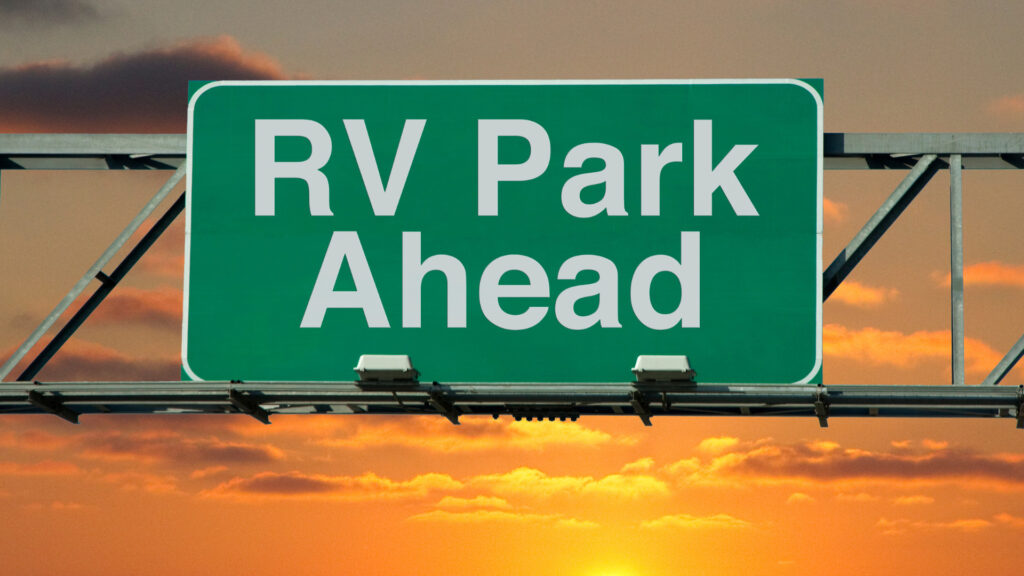 A sign on a highway leading to an RV park