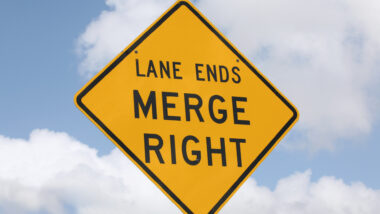 Close up of a lane ending sign