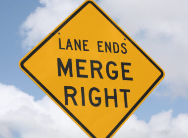 Close up of a lane ending sign