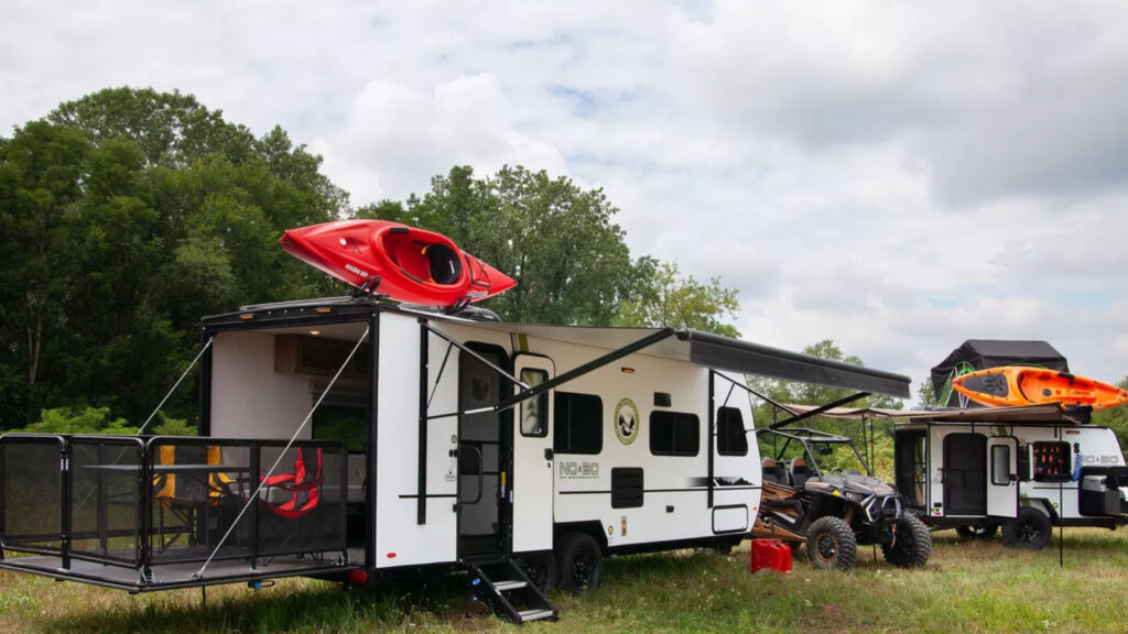 A no boundaries travel trailer parked outside