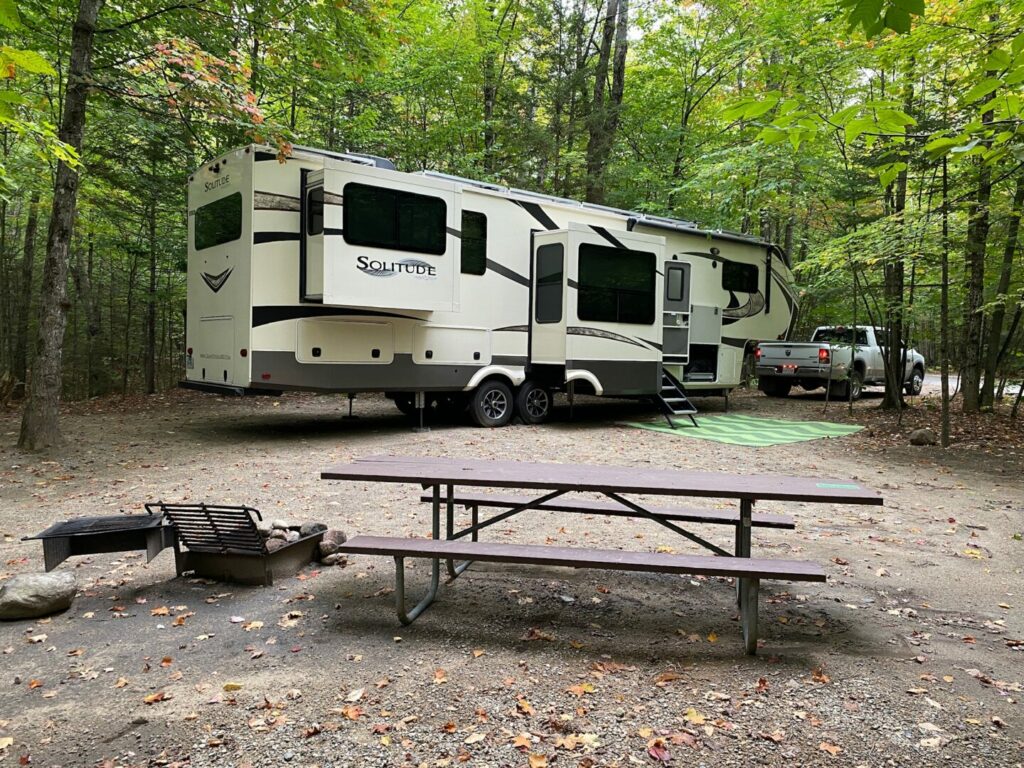 A fifth wheel parked in a campground using the best rv surge protector