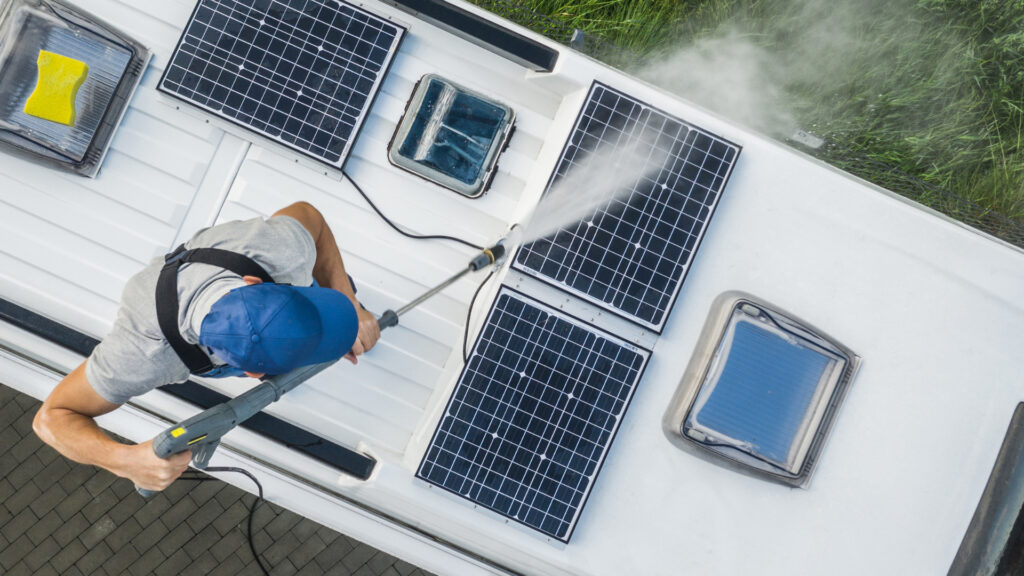 A man cleaning his RV roof