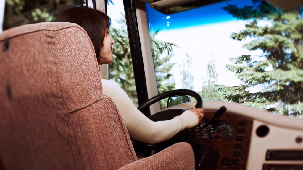 A woman driving an RV