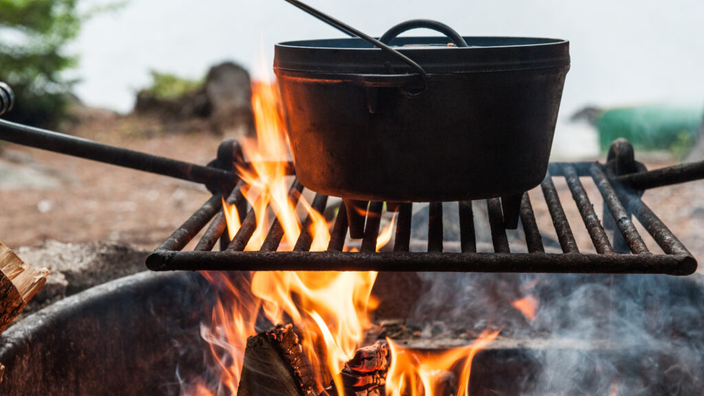 Close up of a pot over a campfire 