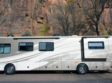 An RV with an RV slide lock parked on the side of a road