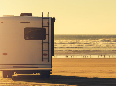 An RV parked at the beach