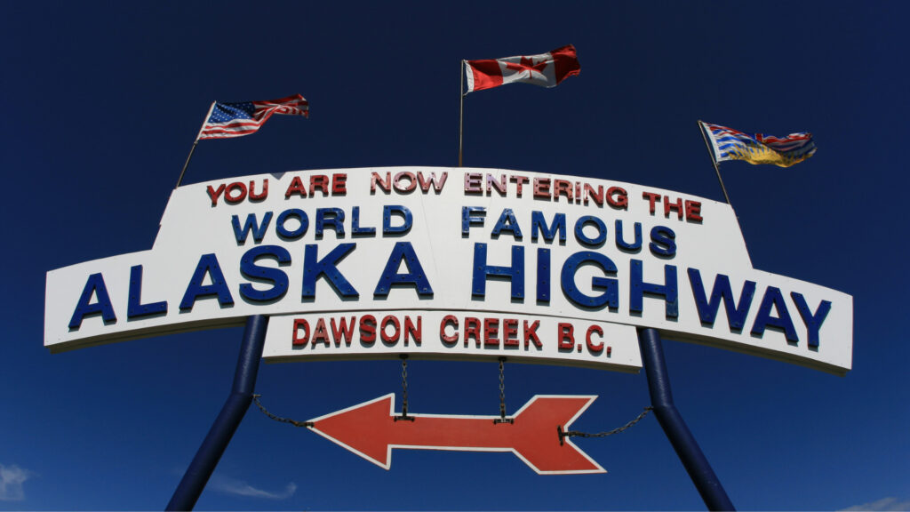 A sign pointing to the world famous Alaska Highway in Dawson's Creek