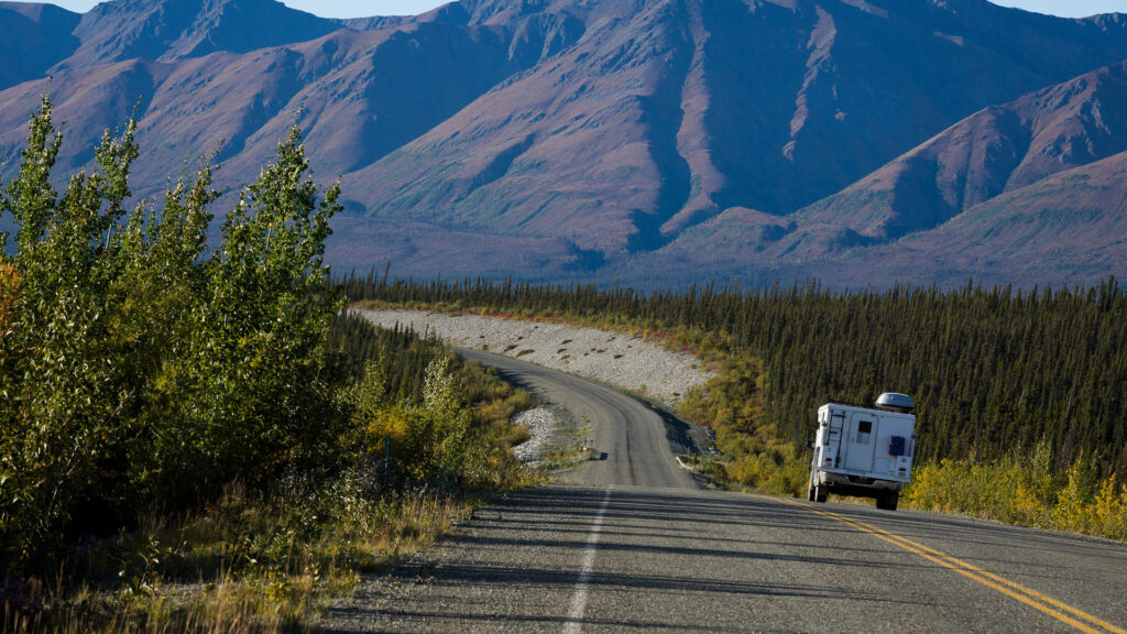 An RV driving on the Highway to Alaska