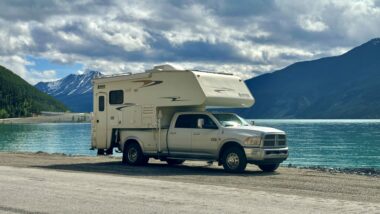 A truck camper parked by Munco Lake
