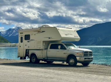 A truck camper parked by Munco Lake