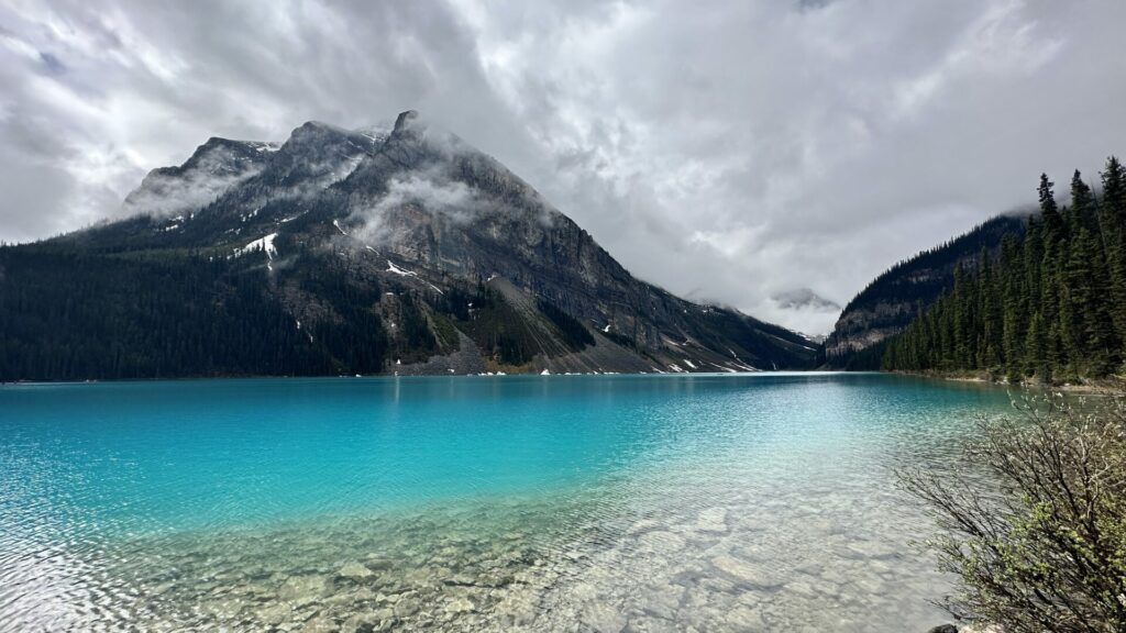 Lake Louise on a cloudy day and blue water 