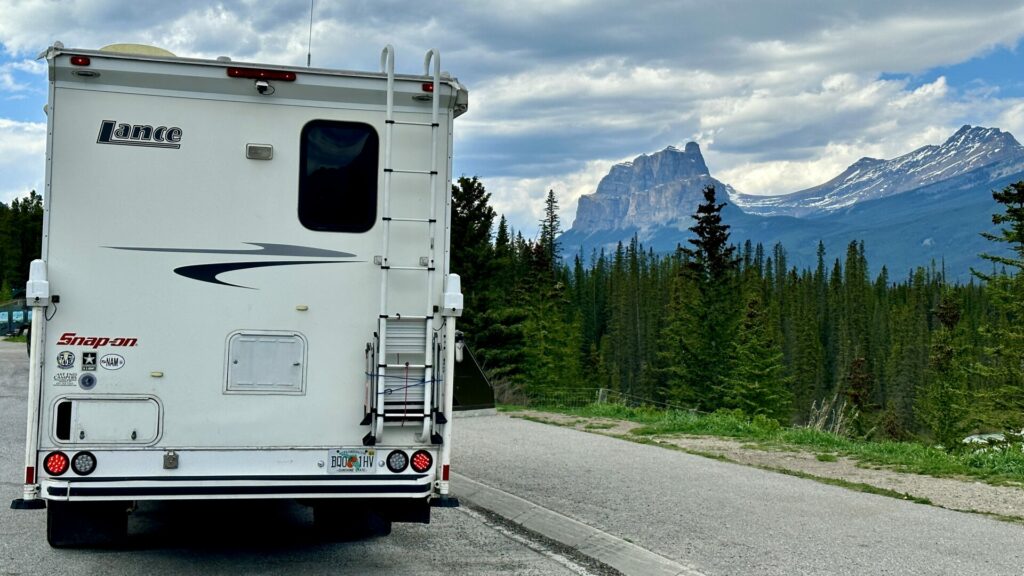An RV driving along the icefields parkway