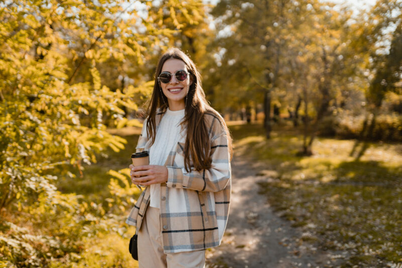 Woman walking through Dublin, New Hampshire in the autumn