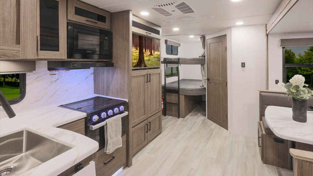 The living room area inside an alliance Delta 251BH travel trailer