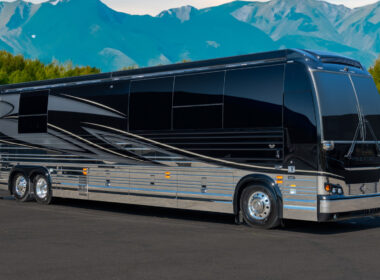 A marathon coach parked outside by the mountains
