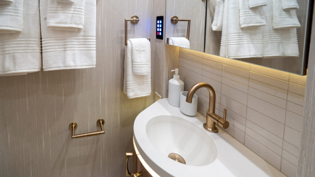 A bathroom inside a marathon coach with a smart house system