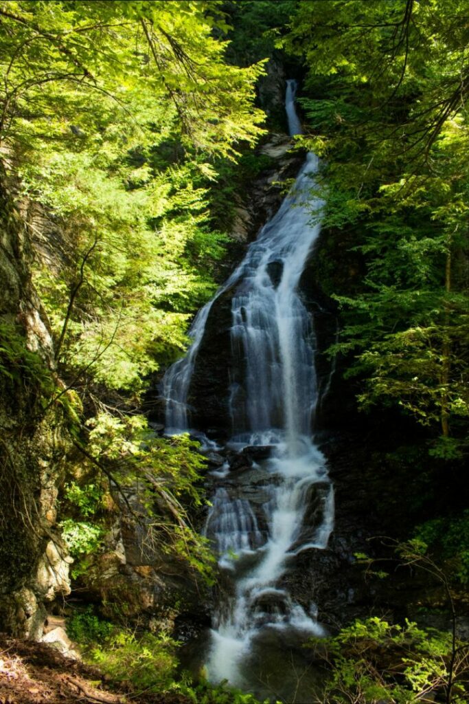 Moss Glen Falls is a horsetail waterfall that fans out along the rocks at the bottom.