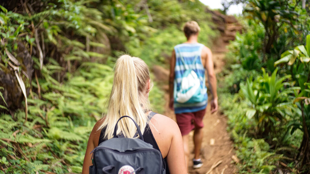 A couple hiking together one Calvaire Trail in Oka National Park.