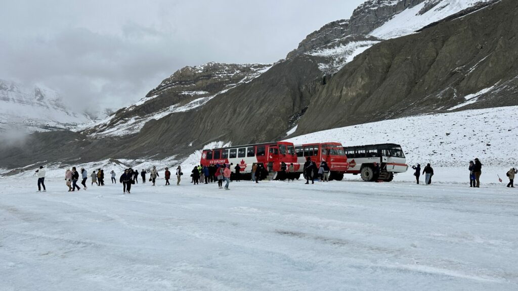 Tourists at the Columbia Icefields Glacier Adventure on a guided tour