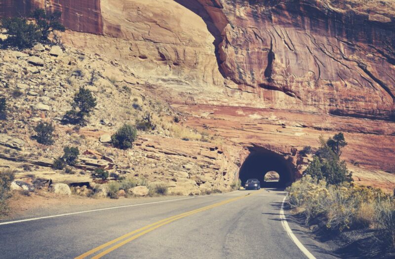 A drive through the iconic Gilman Tunnels in the gorgeous Jemez Mountains is the perfect thing to add to your New Mexico road trip.