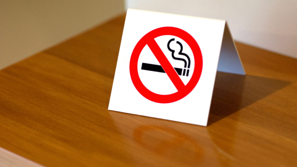 A no smoking sign inside a cruise ship room.