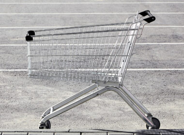 A shopping cart in a Walmart parking lot