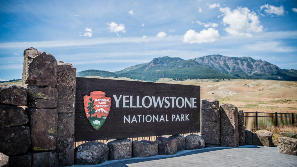 View of Yellowstone National Park with the park sign.